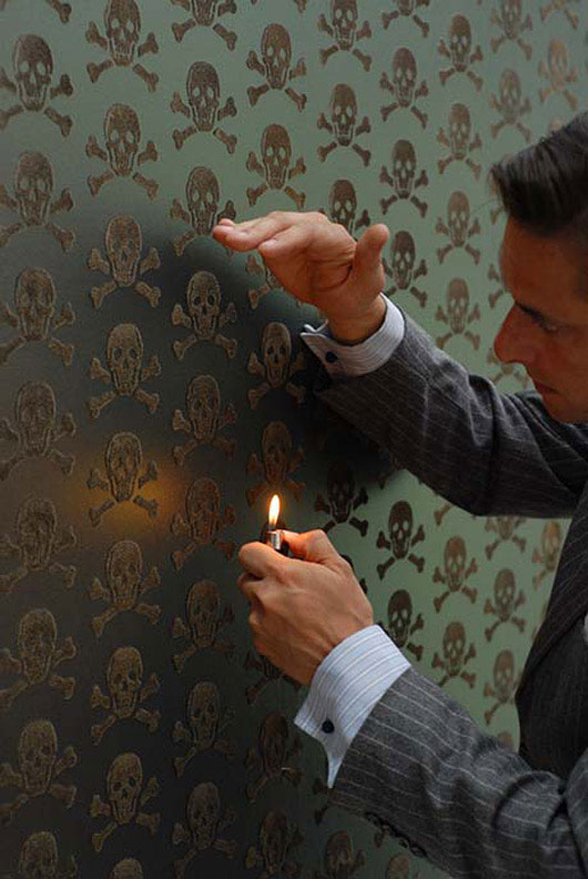 wallpaper2 man holding a lighter and looking closely and decorative wallpaper
