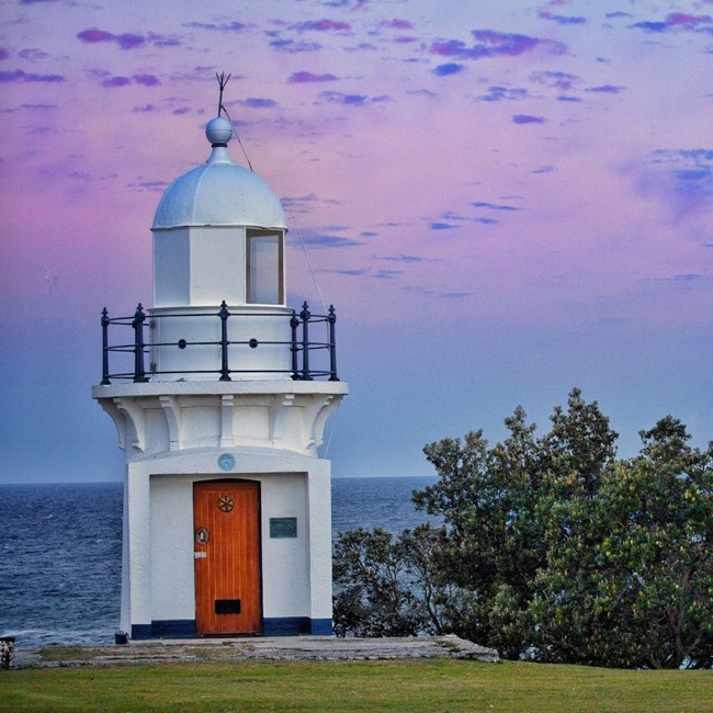 Painters Balina East. beautiful photo of the East-Ballina-Lighthouse taken on dusk with purple and blue hazy sky behind